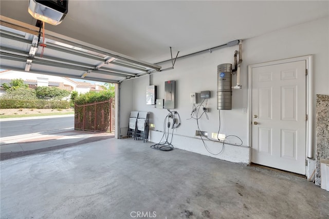 garage with a garage door opener and electric panel