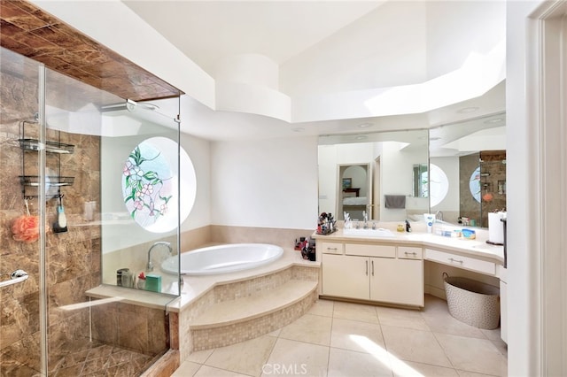 bathroom with vanity, independent shower and bath, and tile patterned floors