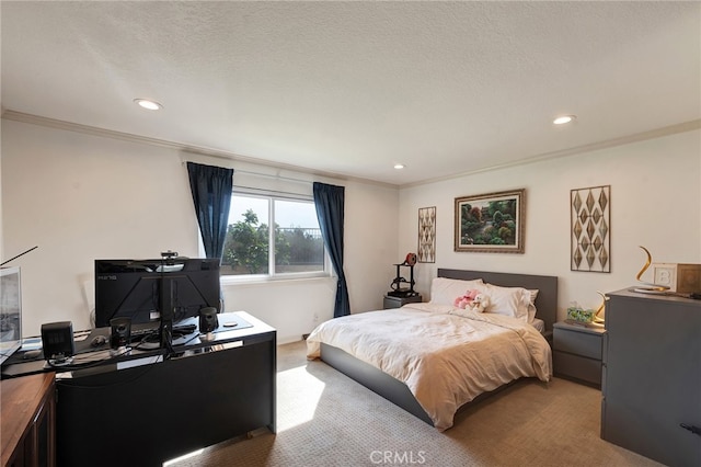 carpeted bedroom with ornamental molding and a textured ceiling