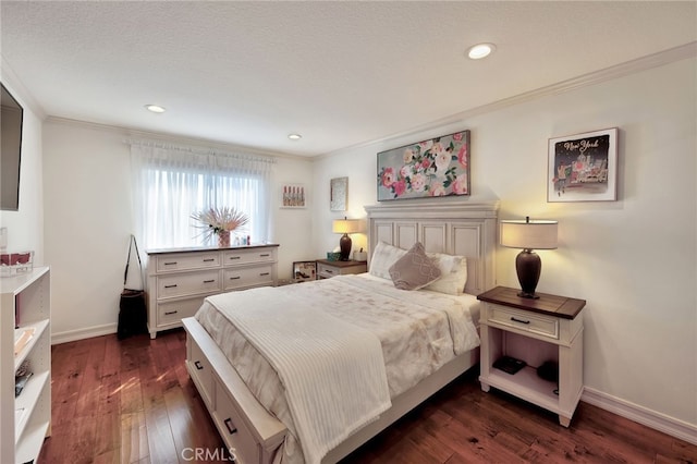 bedroom with dark wood-type flooring, ornamental molding, and a textured ceiling