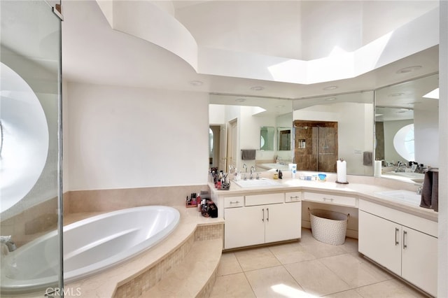 bathroom with vanity, tile patterned flooring, and plus walk in shower