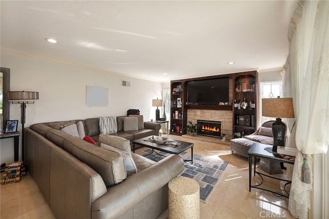 tiled living room with a stone fireplace and crown molding