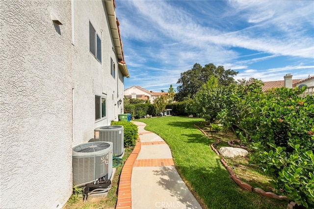 view of yard featuring central AC unit