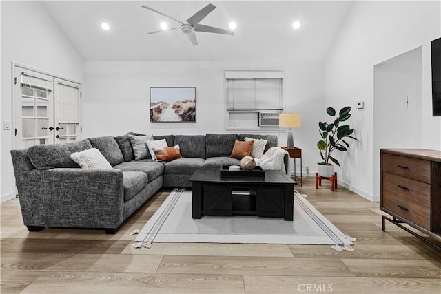 living room featuring french doors, light wood-type flooring, high vaulted ceiling, and ceiling fan