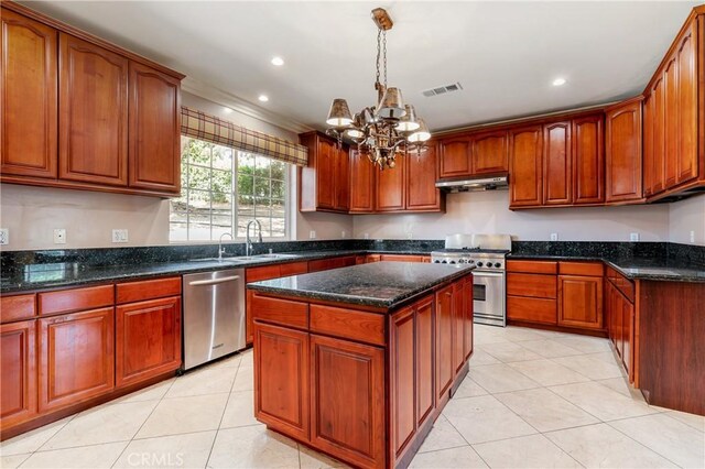 kitchen featuring a center island, an inviting chandelier, appliances with stainless steel finishes, decorative light fixtures, and light tile patterned flooring