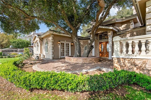 back of property featuring french doors