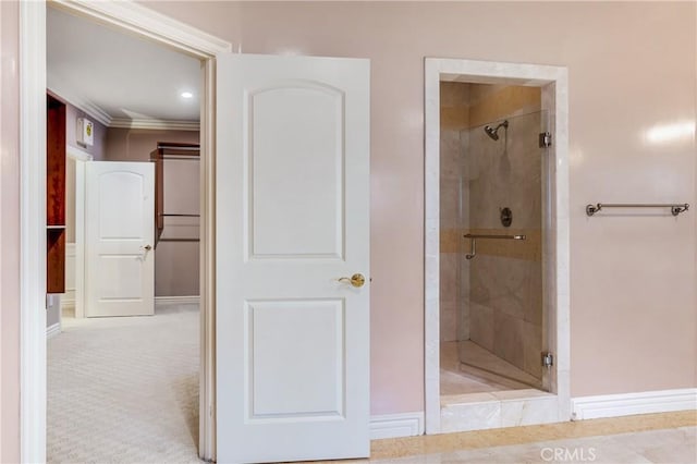 bathroom featuring walk in shower and ornamental molding