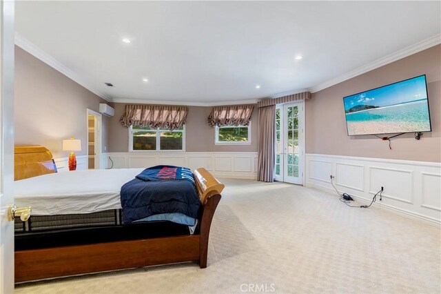 bedroom with access to exterior, an AC wall unit, crown molding, and light carpet