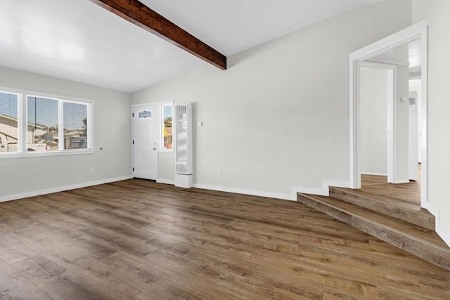 interior space with beamed ceiling and hardwood / wood-style floors