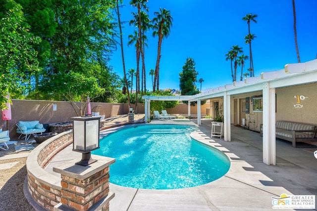 view of swimming pool with a patio area