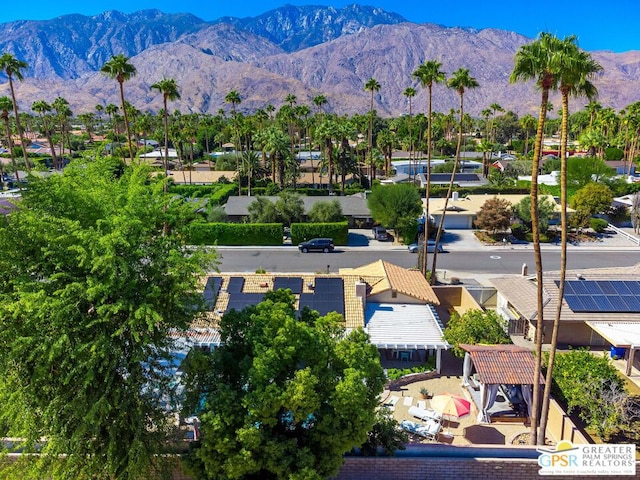 birds eye view of property featuring a mountain view