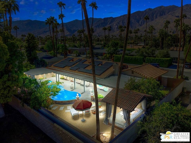 view of swimming pool with a gazebo, a mountain view, and a patio