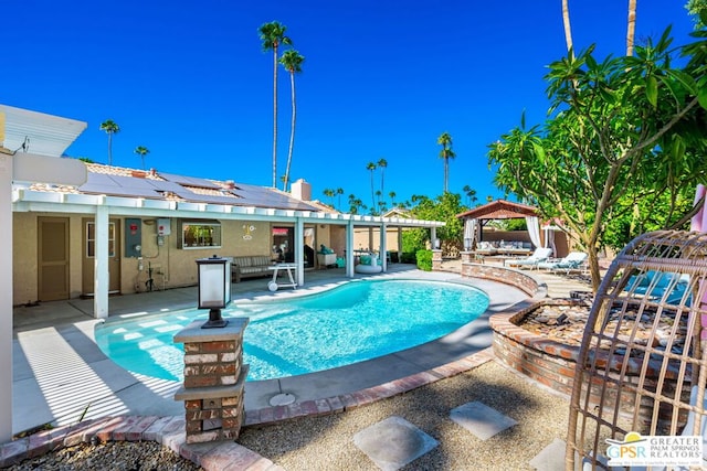 view of swimming pool featuring a gazebo and a patio area