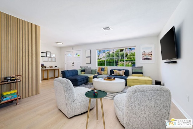 living room with light hardwood / wood-style flooring