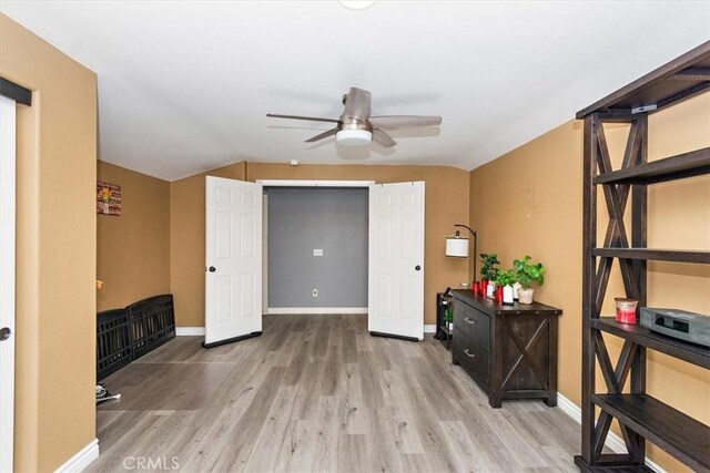 interior space with ceiling fan and light hardwood / wood-style floors