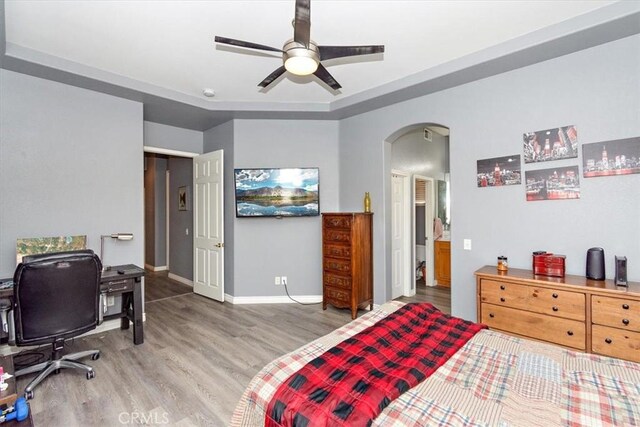 bedroom featuring wood-type flooring and ceiling fan