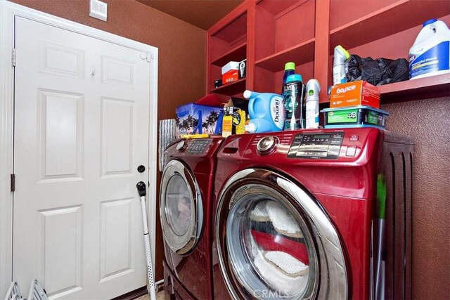 laundry room featuring washer and clothes dryer