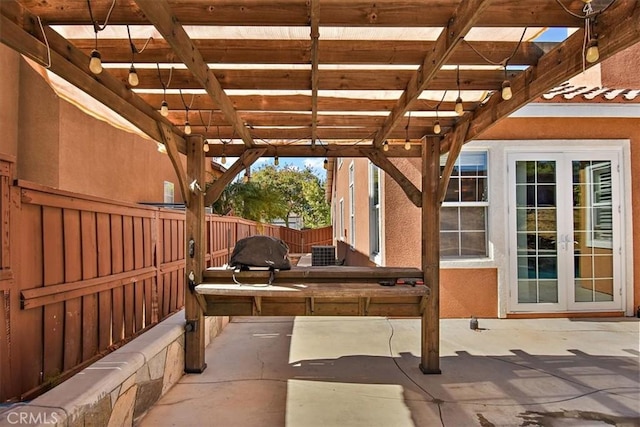 view of patio featuring french doors, a pergola, and central AC