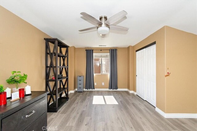 interior space featuring light wood-type flooring and ceiling fan