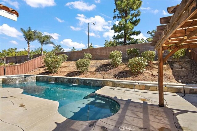 view of pool featuring a patio area and a pergola