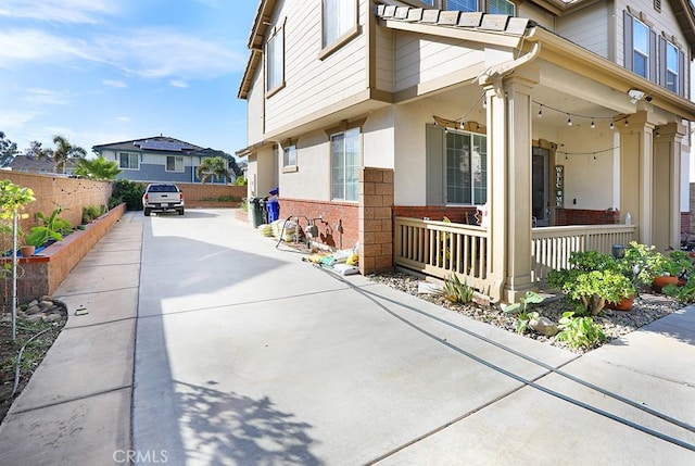 view of property exterior with covered porch