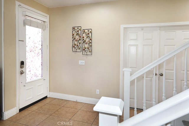 foyer with light tile patterned flooring