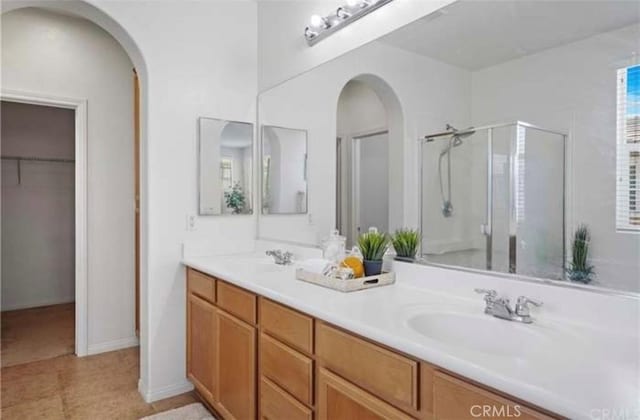 bathroom with vanity and an enclosed shower