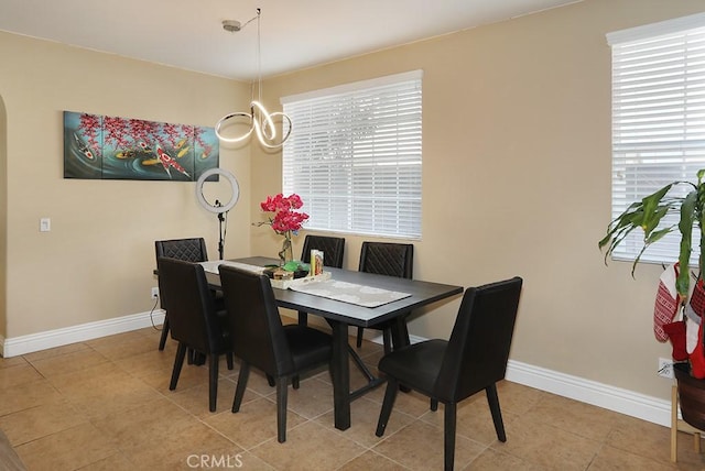 dining area featuring light tile patterned flooring