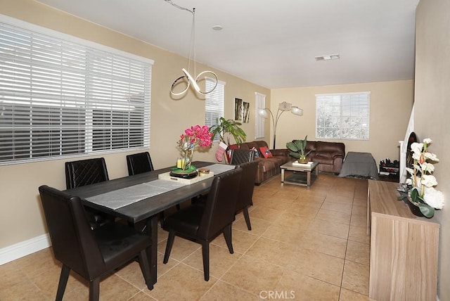 dining space with light tile patterned flooring