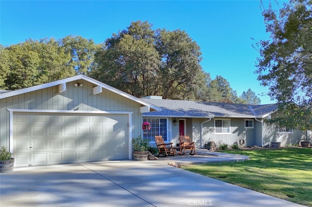 ranch-style home featuring a front yard and a garage