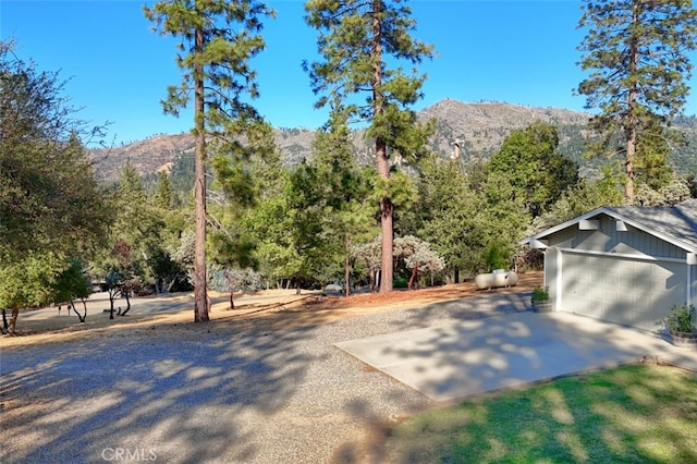 exterior space with a mountain view and a garage