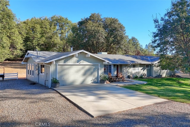 single story home featuring a front yard and a garage