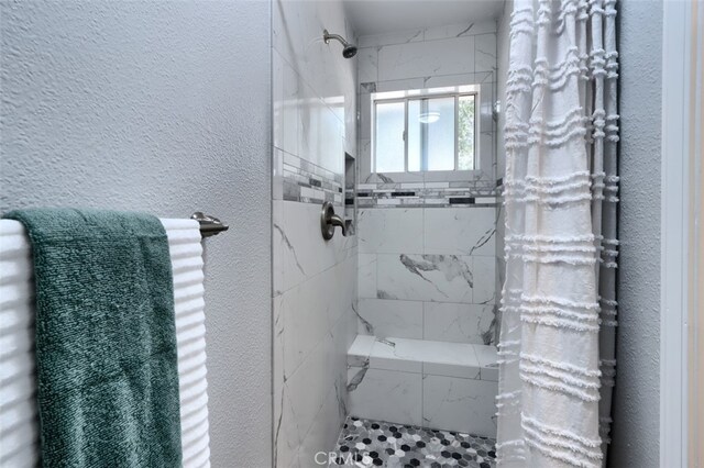 bathroom featuring curtained shower