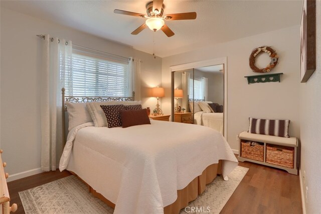 bedroom featuring a closet, wood-type flooring, and ceiling fan