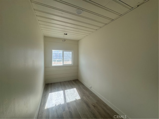 spare room with wood-type flooring