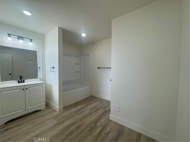 bathroom with vanity, shower / bath combination, and hardwood / wood-style floors