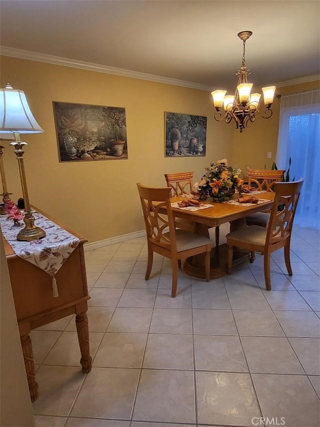 dining room with a notable chandelier, ornamental molding, and light tile patterned floors