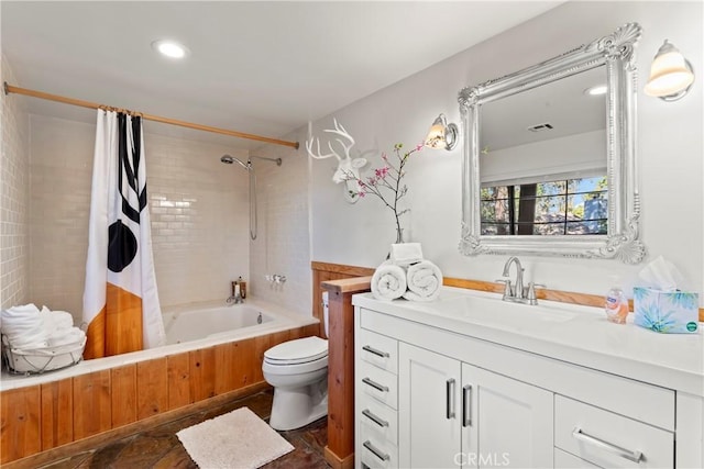 full bathroom featuring vanity, toilet, and shower / tub combo