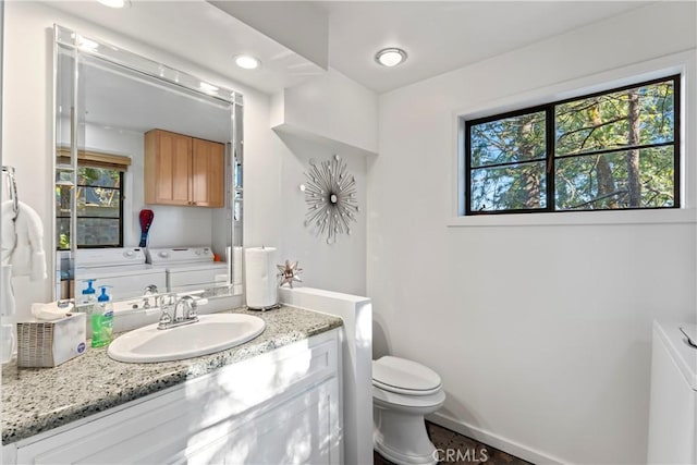 309 Castle Gate Rd, Lake Arrowhead, CA 92352 - bathroom featuring washer and dryer, plenty of natural light, and vanity