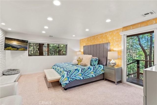 bedroom with access to exterior, light colored carpet, and multiple windows