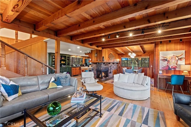 309 Castle Gate Rd, Lake Arrowhead, CA 92352 - living room with wood walls, light wood-type flooring, stairway, a wood ceiling with exposed beams, and a chandelier