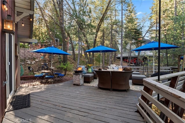 309 Castle Gate Rd, Lake Arrowhead, CA 92352 - wooden deck with outdoor lounge area and outdoor dining space