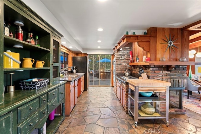 kitchen with black fridge and sink