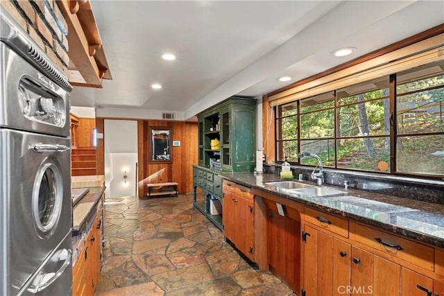 309 Castle Gate Rd, Lake Arrowhead, CA 92352 - kitchen with dark stone finish flooring, recessed lighting, dark stone countertops, brown cabinetry, and open shelves