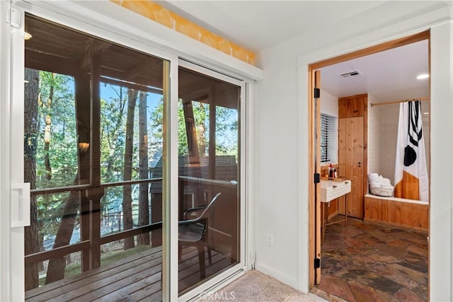 309 Castle Gate Rd, Lake Arrowhead, CA 92352 - entryway with baseboards and stone finish flooring