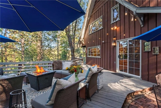 309 Castle Gate Rd, Lake Arrowhead, CA 92352 - wooden deck with an outdoor living space with a fire pit