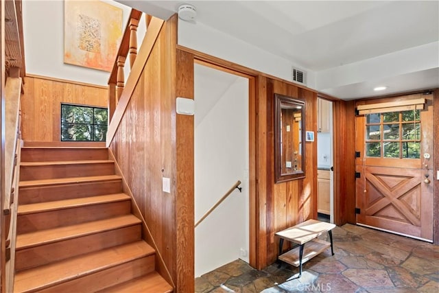 309 Castle Gate Rd, Lake Arrowhead, CA 92352 - staircase with stone finish floors and wooden walls
