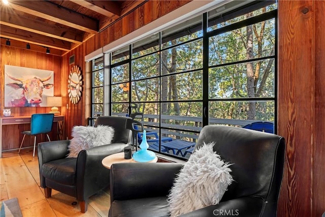 sunroom with beamed ceiling