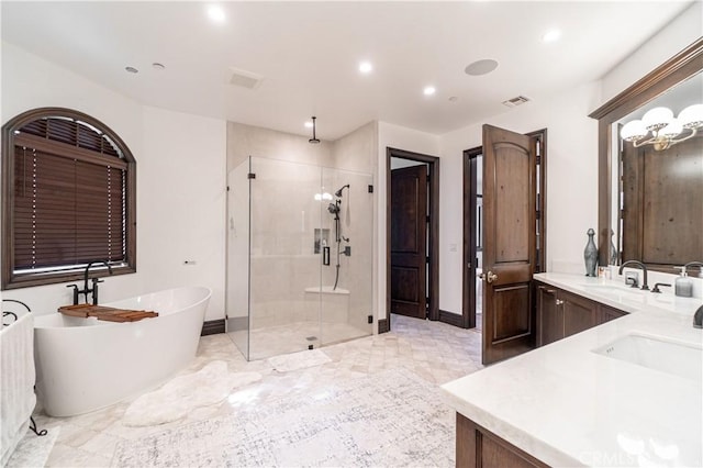 bathroom featuring double vanity, baseboards, a soaking tub, a sink, and a shower stall