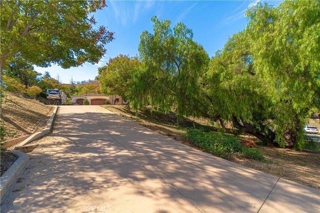 surrounding community featuring driveway